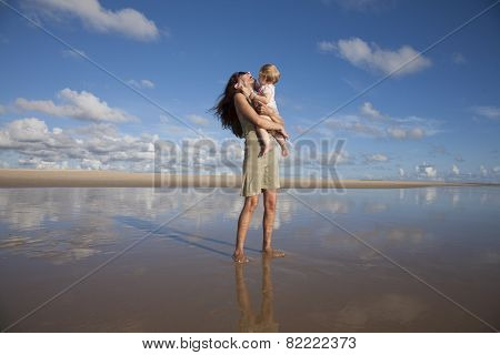 Laughing Woman With Baby At Reflect Beach