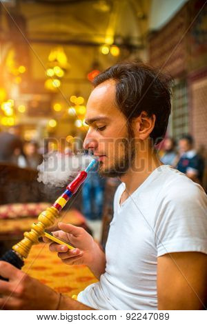 Man smoking turkish hookah