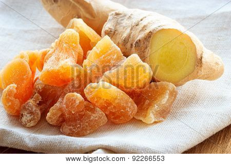 Closeup Root And Candied Ginger On Rustic Table