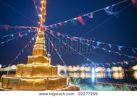 Building Sand Pagoda and bokeh of bridge background Songkarn Festival Tak ,Thailand