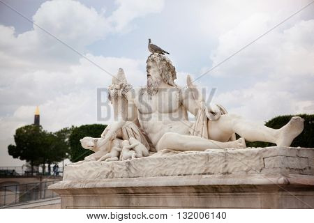 The statue Le Tibre in Tuileries Garden in Paris.