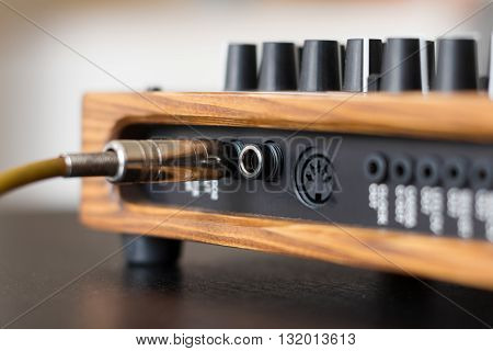 Jack plug cable on synthesizer macro - music concept