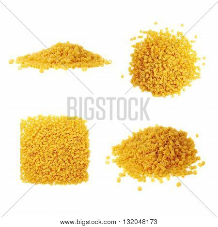 Set of pile of dry ditalini yellow pasta over isolated white background, different foreshortenings