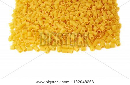 Pile of dry ditalini yellow pasta over isolated white background