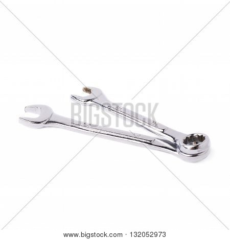 Couple of wrenchs chrome metal spanner instruments isolated over white background