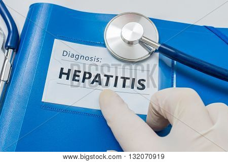 Blue folder with Hepatitis C diagnosis. Medicine concept.