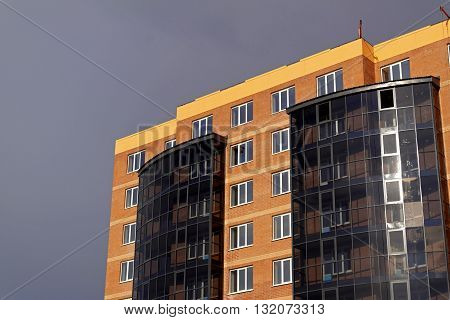Construction budgetary apartment house on a street in the city