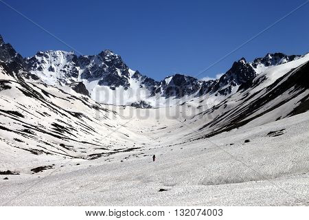 Hiker in snowy mountains at nice day. Turkey Kachkar Mountains in spring (highest part of Pontic Mountains).
