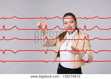 Doctor woman working with cardiogram lines
