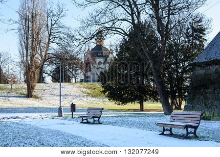 Benches in a deserted winter park in Prague