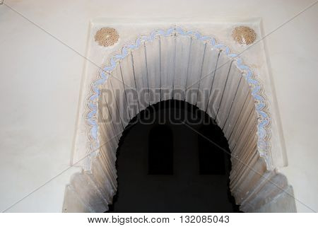 MALAGA, SPAIN - JULY 11, 2008 - Ornate arch within the Nasrid Palace Malaga Castle (Alcazaba de Malaga) Malaga Malaga Province Andalucia Spain Western Europe, July 11, 2008.