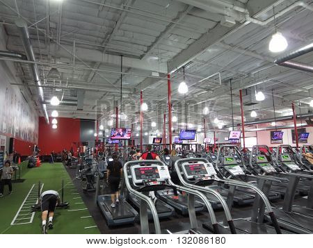 TORRANCE CALIFORNIA - JANUARY 22: People workout Inside UFC Gym Torrance on January 22 2014. UFC theme gym has locations across the USA.