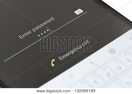Melbourne, Australia - May 23, 2016: Entering password on the lock screen of an Android phone. The lock screen improves smartphone security, users can unlock their phone by entering password, pin or drawing pattern.