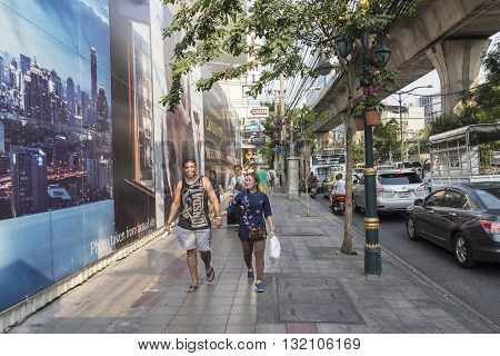BANGKOK THAILAND - APR 29 : unidentified people on pavement at Sukhumvit road near Asoke area on april 29 2016 thailand.