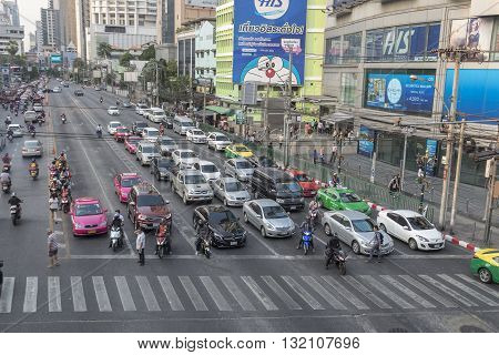 BANGKOK THAILAND - APR 29 : scene of traffic stop on red light signal at Asoke junction on april 29 2016 thailand. traffic jam is one of worse issue of Bangkok