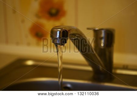 Water flow running down from the faucet