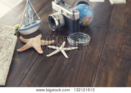 Compass, Camera, Globe,map, Car, Ship And Starfish Figurine For Use As Trip Vacation Concept (vintag