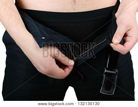 Hands Of A Man Unzips His Fly Of Their Pants