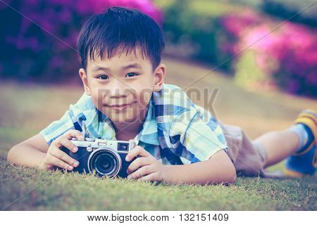 Boy Taking Photo By Camera, Exploring Nature At Park. Active Lifestyle, Curiosity, Pursuing A Hobby