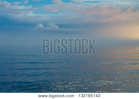Blue waves with blue sky and clouds at Baikal lake