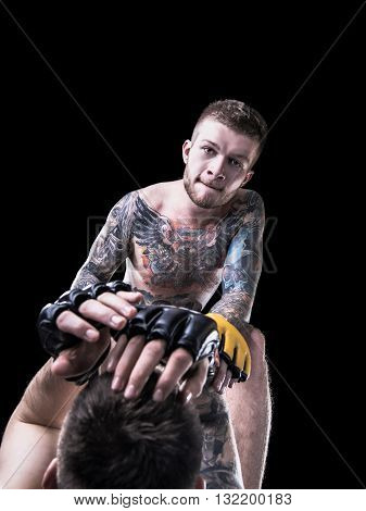 MMA fighter throwing punches on black background