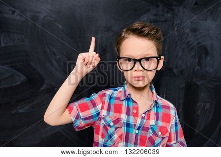 Portrait Of Little Genious In Glasses Having Great Idea