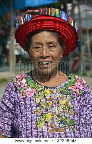 SANTIAGO DE ATITLAN GUATEMALA APRIL 29 2016: Tzutujil woman show to wearing a traditional toyocal hat. The Mayan people still make up a majority of the population in Guatemala,