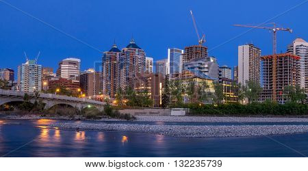 CALGARY, CANADA - MAY 7: Panorama of Calgary's skyline along the Louise Bridge on May 7, 2016 in Calgary, Alberta. The Louise Bridge connects Kensington with downtown Calgary over the Bow River.