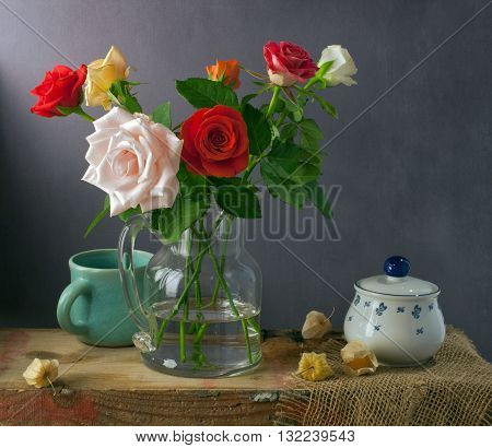 Still life with colorful roses and physalis