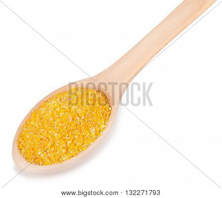 wooden spoon with maize grits isolated on white background. Corn grits polenta in spoon closeup isolated on white background