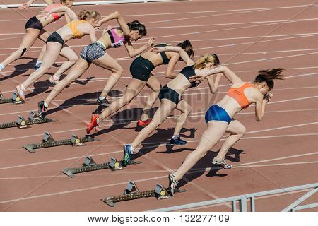 Chelyabinsk Russia - May 24 2016: group of girls athletes start to sprint 100 meters during UrFO Championship in athletics