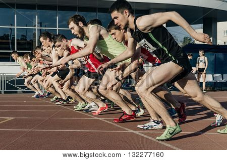 Chelyabinsk Russia - May 24 2016: group start men athletes at stayers distance of 1500 meters in stadium during UrFO Championship in athletics