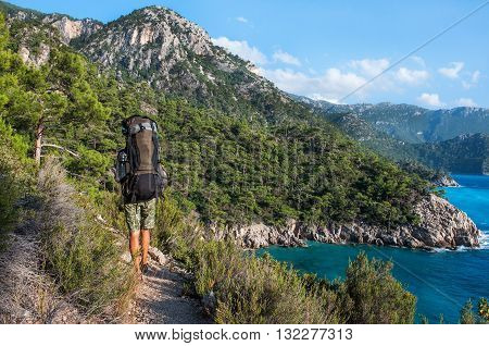 Hiking in Turkey. Lycian Way. Backpacker by the sea. The track is completed