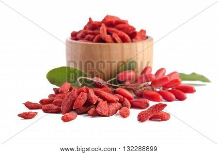berberries near goji berries heap and bowl with goji isolated on white background