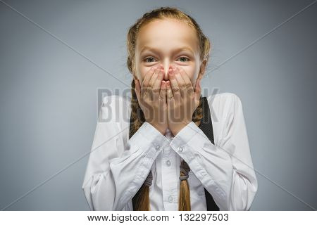 Closeup Portrait of happy girl going surprise isolated on gray background.