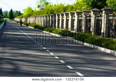 Carefree driving on a bright sunny day. Image of wide open prairie with paved highway stretching out as far as eye can see.