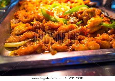 Chinese food buffet self service Teriyaki chicken with green bell peppers