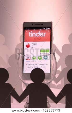 Kuala Lumpur Malaysia, 28th may 2016, of people man surrounding  at social network tinder sign in page on smartphone