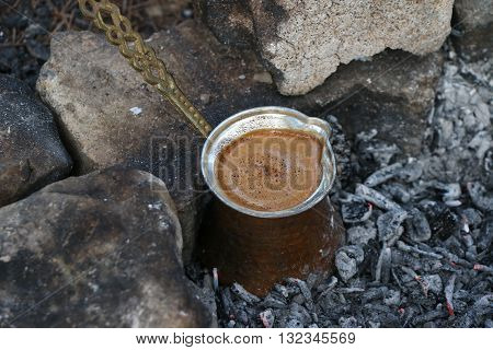 Ember Turkish coffee. Roasted Turkish coffee. Traditional nubian coffee making. Coffee turk on the coal.