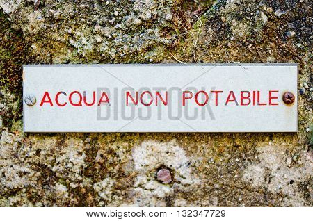 label for non potable water on old wall