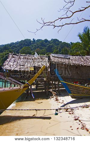 Typical houses on stilts in the Moken Sea Village on Koh Surin Tai in the Surin Islands National Park Phang Nga Thailand.