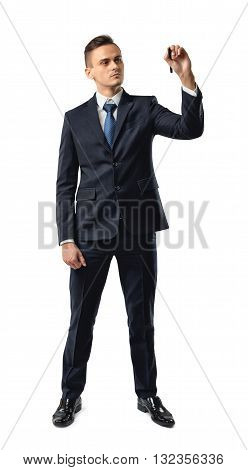 Cutout serious businessman writes something important on invisible surface. Southpaw. Learning and teaching. Training. Study process. Successful lifestyle. Business staff.