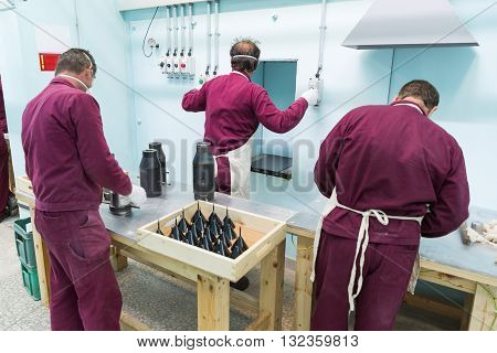 Workers Near Ammo Machine In Munition Factory