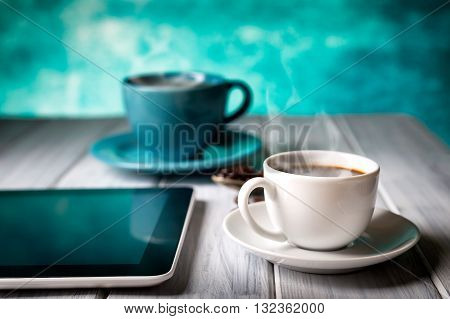 Coffee And Tablet On The Table