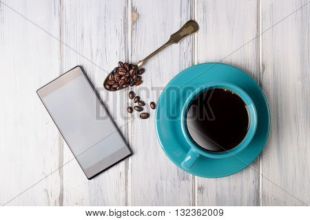 Coffee And Smart Phone On The Table