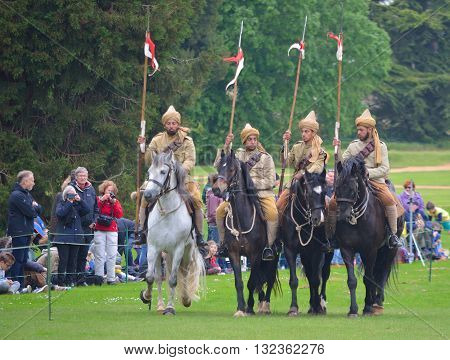 Silsoe, Bedfordshire, England - May 30, 2016:  Four members of the Punjab Lancers in World War One uniform riding horses.