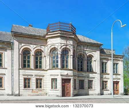 Facade Of Old House In Ventspils Of Latvia In Spring