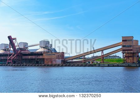 Loading Cranes And Factory At The Marina In Ventspils
