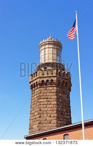 Light Station And Flag At Sandy Hook In New Jersey