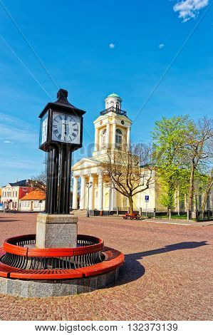 Clock And Lutheran Church Of Saint Nicholas In Ventspils
